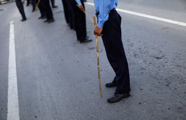 14 April 2009: Islamabad, Pakistan: Policemen during a rally of over 100 unemployed people