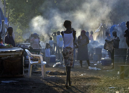 14 April 2009: Souvenance, Haiti: A woman walks through a market