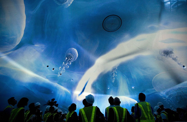 14 April 2009: Macau: Members of the media watch a multimedia show