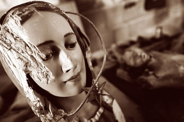 Sepia photography: Sepia: the head of a wooden Madonna damaged by an earthquake