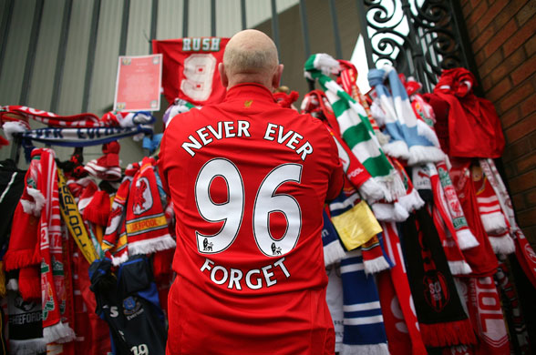 Hillsborough anniversary: Liverpool fans pay their respects at the Hillsborough memorial at Anfield
