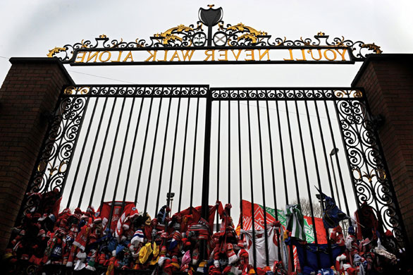 Hillsborough anniversary: Liverpool supporters tie scarves to the Shankly Gates