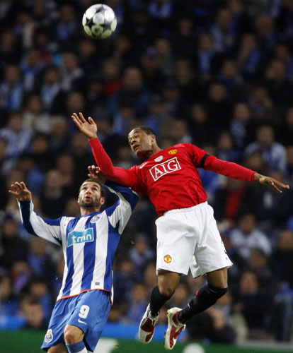 Porto v Manchester United: Patrice Evra and Porto's Lisandro Lopez go up for a header 
