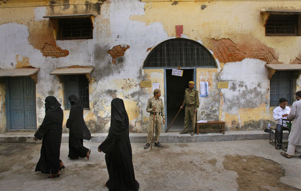 Elections in India: Women leave a polling station after casting their votes in Varanasi