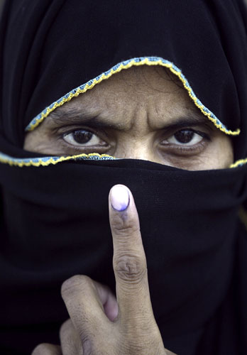 Elections in India: A woman after casting her vote in Rajapur village