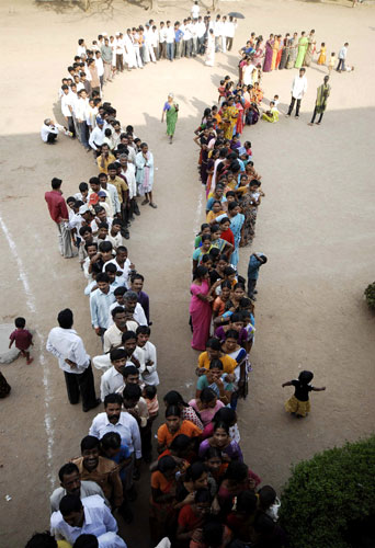 Elections in India People wait to vote at a polling station on the 