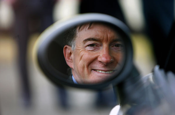 Week in business: Business Secretary Peter Mandelson is reflected in an electric Mini car