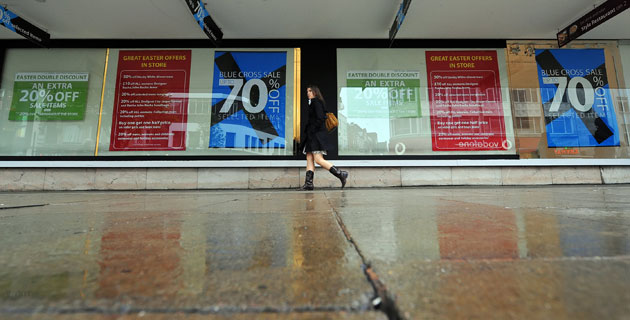 Week in business: A lone shopper walks on the near-empty pavements of Oxford Street, London