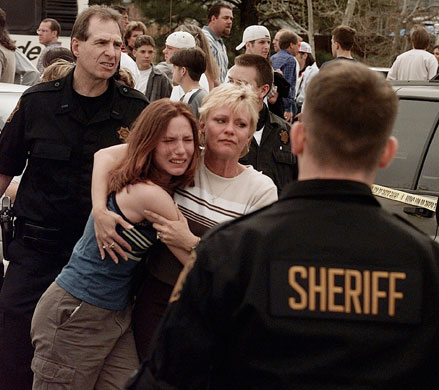 Columbine shootings: A woman embraces her daughter after they were reunited