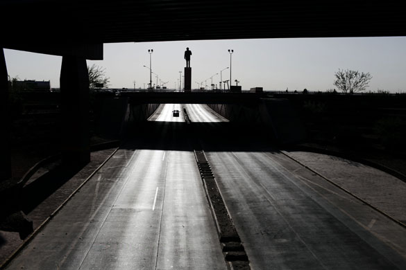 24 hours in pictures: A road and statue of former President Benito Juarez in Ciudad Juarez Mexico