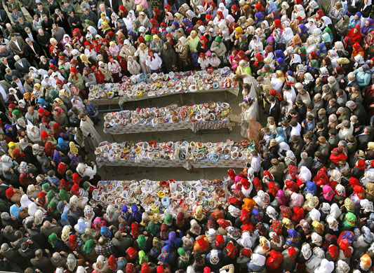 24 hours in pictures: Sarichioi, Romania: Ethnic Russians wait for priests to bless food.