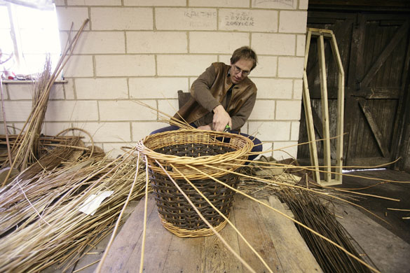 Basket making: P. H. Coate & Son: Jonathan Coate at work making a willow basket