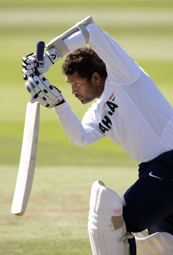 24 Hours in pictures: India's Tendulkar plays a shot during a training session