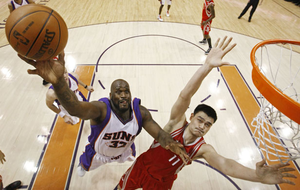 24 Hours in pictures: Phoenix Suns' Shaquille O'Neal  takes a shot during NBA basketball game
