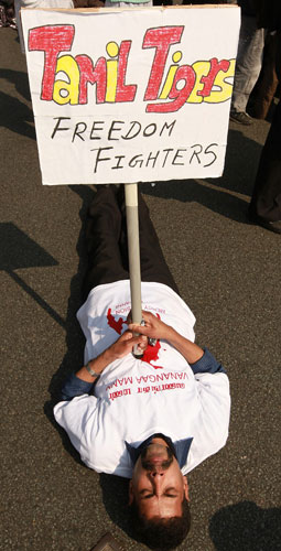 Tamil protest in  London : tamil protesters block the road outside the houses of parliament