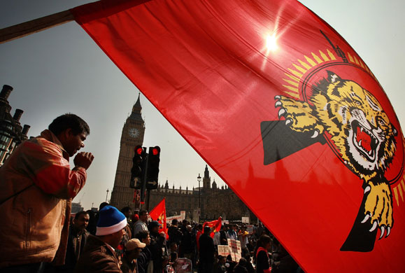 Tamil protest in  London : tamil protesters block the road outside the houses of parliament