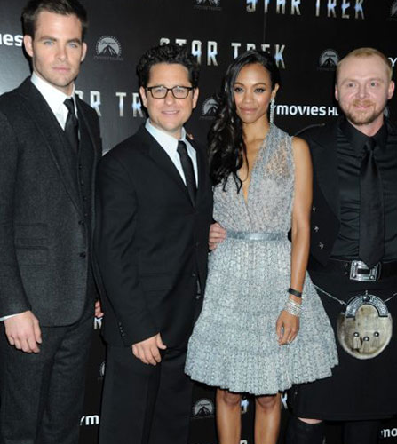 second from left) does his best...