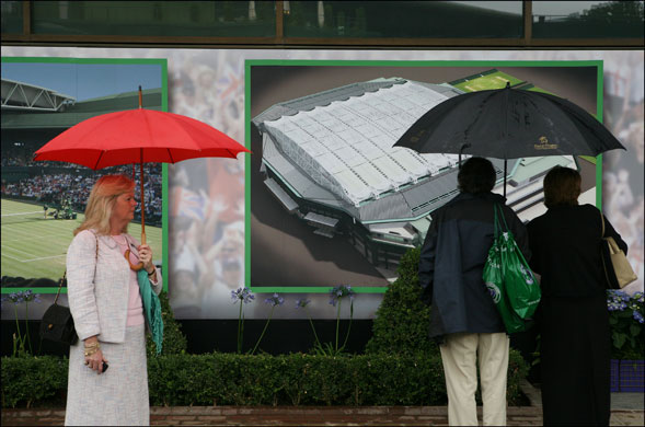 Wimbledon new roof: Spectators looking at illustrations of the new centre court roof.