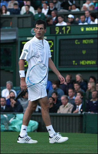 Wimbledon roof: Tim Henman looks to the referee as his match is called off for bad light.