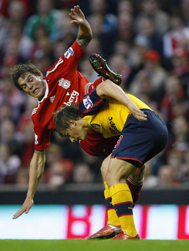 Liverpool v Arsenal: Daniel Agger challenges Andrey Arshavin