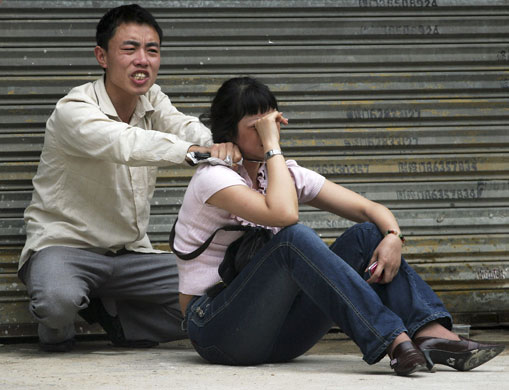 24 hours in pictures: A man with a knife holds a woman hostage on a street in Guangzhou