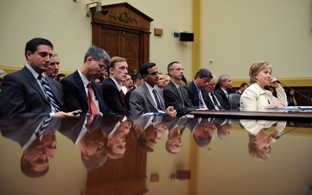 24 hours in pictures: Hillary Clinton with her staff  at House Foreign Affairs Committee