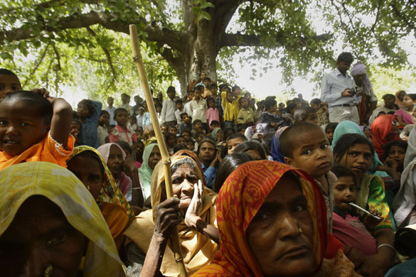 24 hours in pictures: People listen to Priyanka Vadra during an election campaign