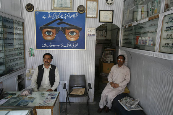 Swat valley : Opticians shop in the main shopping area of Mingora, Swat Valley, Pakistan 