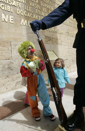 24 hours in pictures: School children stand next to a Turkish soldier