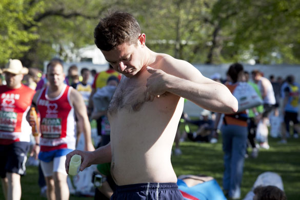 London Marathon : A runner applies vaseline to his nipples before the London Marathon
