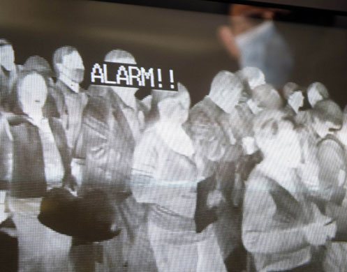 Swine Flu Outbreak: Quarantine officials scan temperatures of passengers, Narita airport, Japan