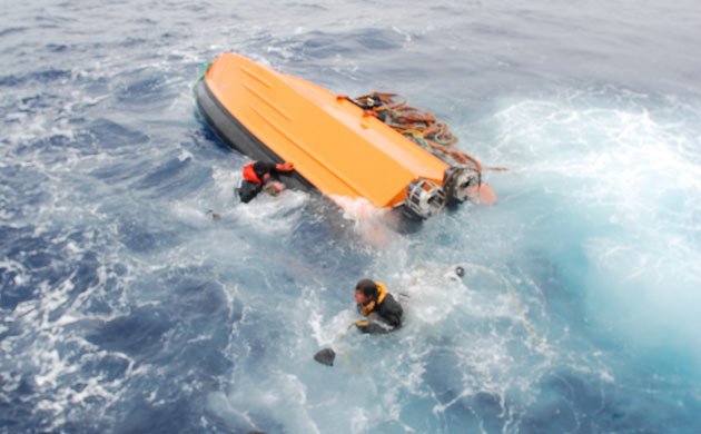 An inflatable capsizes in icy Antarctic waters