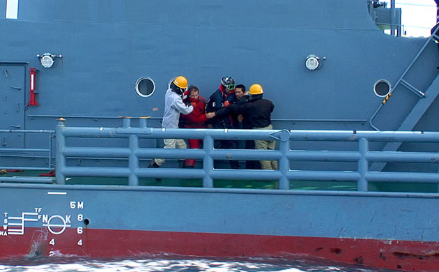 Giles and Potts are captured by Japanese crew