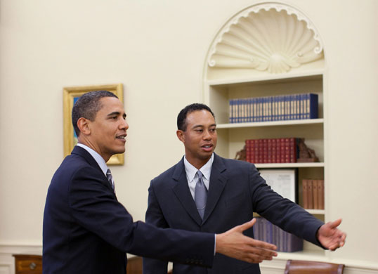 obama 100 days : Barack Obama meets with professional golfer Tiger Woods in the Oval Office 