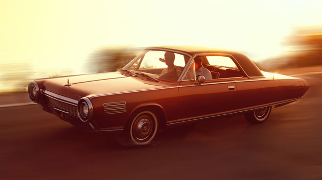 Chrysler cars timeline: A 1963 Chrysler Turbine concept car on a rural road 