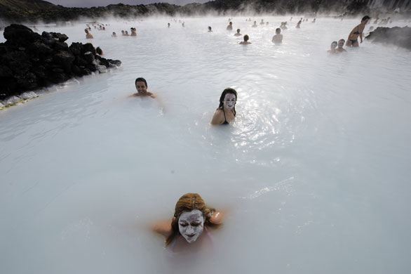 28 April 2009: Iceland: Tourists stand in the Blue Lagoon near Reykjavik