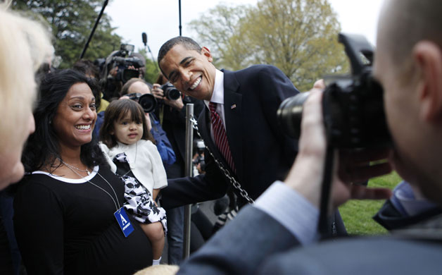 obama 100 days : President Barack Obama poses for a photo