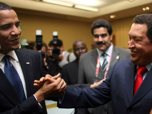obama 100 days : Barack Obama and Hugo Chavez shake hands at the summit of the americas