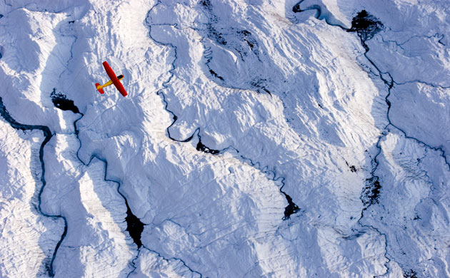 Glaciers under treat: Small Plane Flying Over Glacier