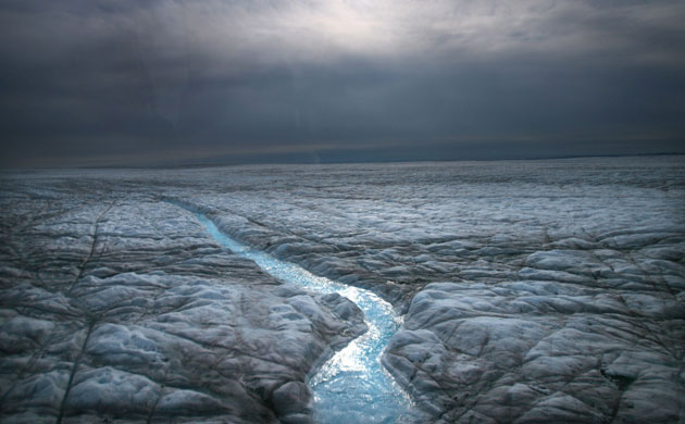 Glaciers under treat: Melted water runs over the Greenlandic Icecap , east to  Ilulissat