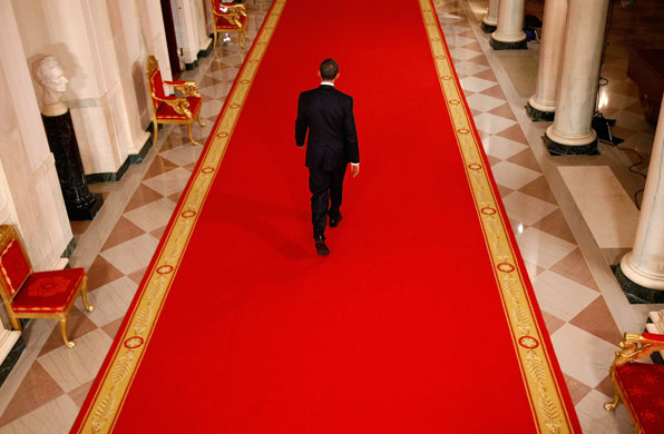 100 days obama: US President Barack Obama leaves after a news conference at the White House
