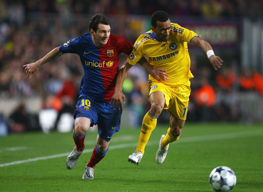 Barca v Chelsea: Lionel Messi is challenged by Jose Bosingwa