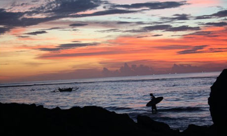 A surfer in Bingin, Bali, Indonesia. Photograph: Paul Owen