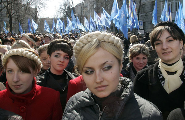 24 hours in pictures: Women wearing braids like Ukraine's Prime Minister Yulia Tymoshenko 