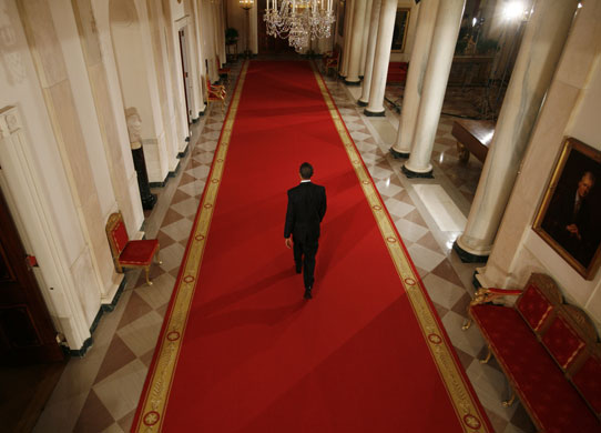 30 April 2009: Washington, US: Barack Obama leaves a news conference in the White House