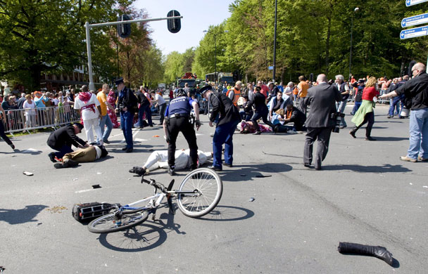 Netherlands car crash: Ceremonial guards and bystanders attend to injured victims