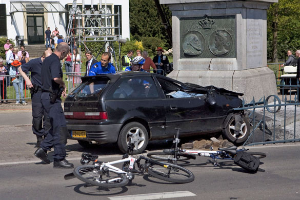 Netherlands car crash: Police officers surround the car