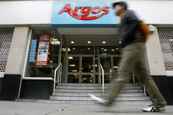 Week in Business: A pedestrian passes a branch of Argos in central London.