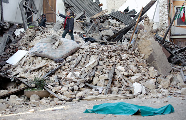 Italy earthquake: The body of a victim lies on the street