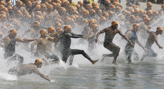 Sport: 24 hours: Swimmers plunge into the water during a competition in Rio de Janeiro
